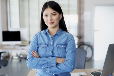 Portrait of a young woman using phone
