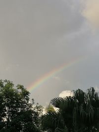 Low angle view of rainbow against sky