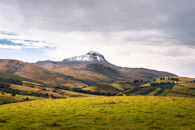 Scenic view of landscape and mountains against sky