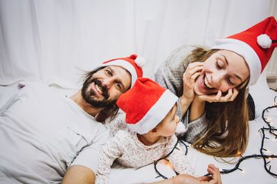 Young couple lying on bed at home