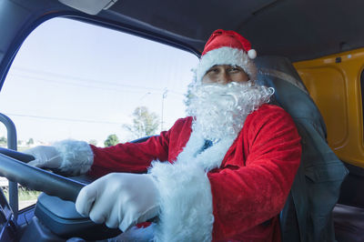 Portrait of woman sitting in car