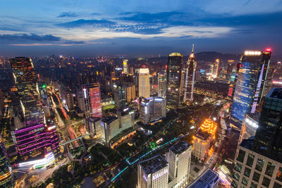 High angle view of illuminated city buildings against sky