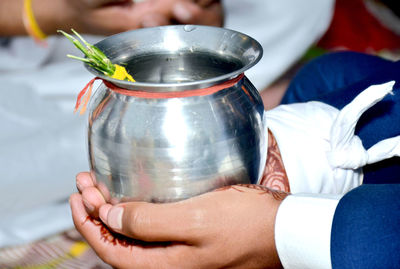 Close-up of woman holding glass