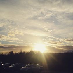 Scenic view of landscape against sky at sunset