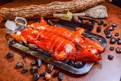 High angle view of grilled pork in plate on table