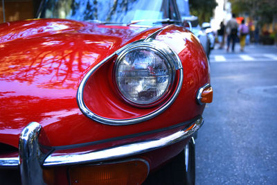 Close-up of vintage car on street