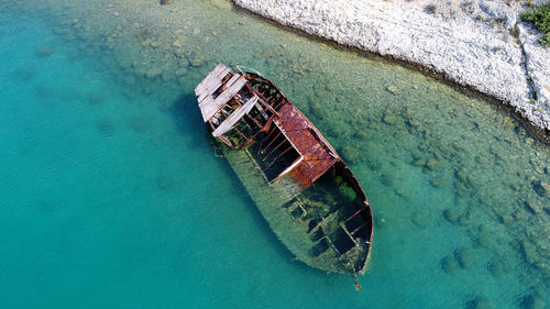 High angle view of abandoned boat in sea