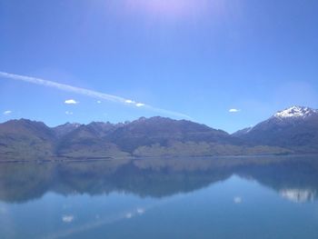 Scenic view of lake against blue sky