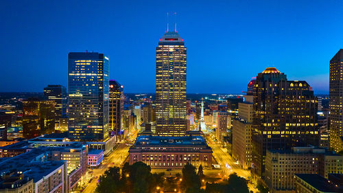 Illuminated buildings in city at night