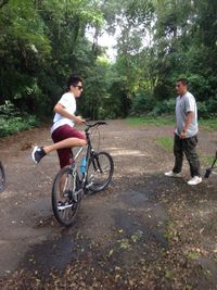 Young woman riding bicycle