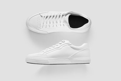 Close-up of shoes against white background