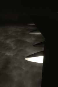 Low angle view of illuminated lamp against sky