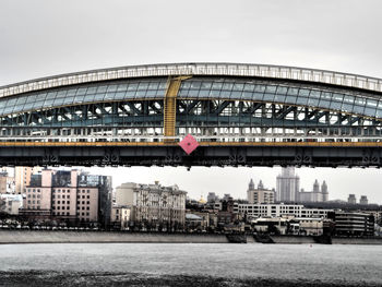 View of bridge against cloudy sky