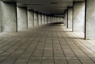 Empty arcade under bridge