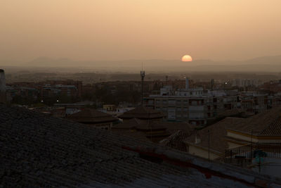 High angle view of cityscape against sky during sunset