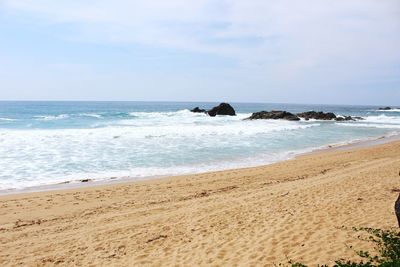 Scenic view of beach against sky