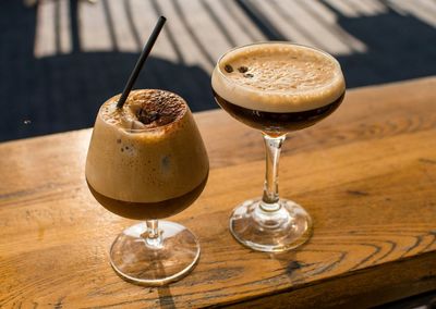 Close-up of wine glasses on table
