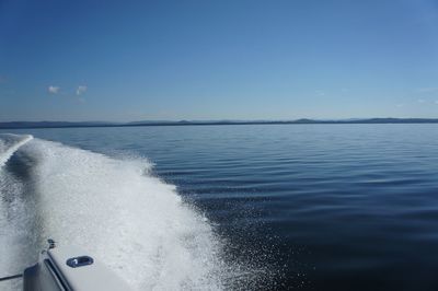 Scenic view of sea against blue sky