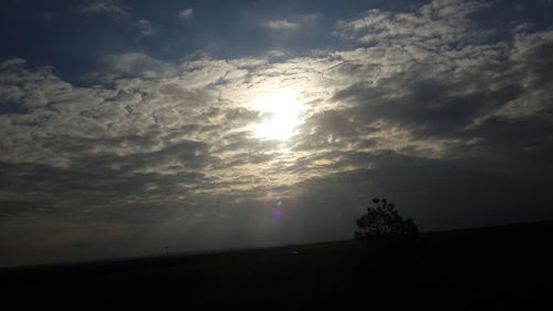 Sun shining through clouds