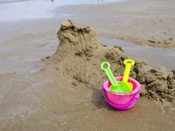 Bucket and spade for children on the beach summer concept..