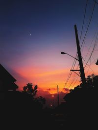 Low angle view of silhouette trees against sky during sunset