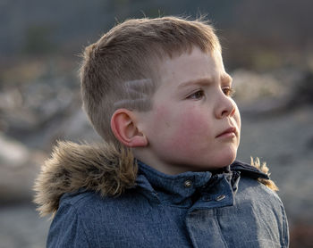 Close-up of boy looking away 