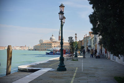 Panoramic view of buildings in city against sky