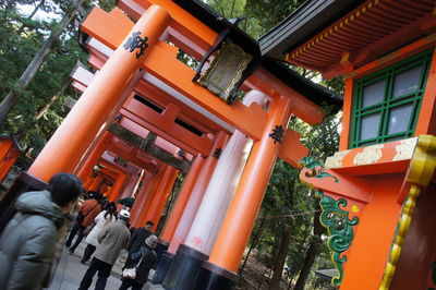 People walking outside temple