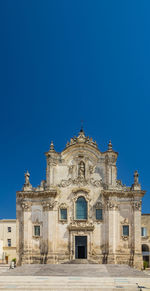 Low angle view of building against blue sky