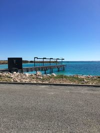Scenic view of sea against clear blue sky