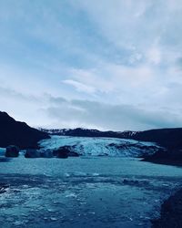 Scenic view of landscape against sky during winter