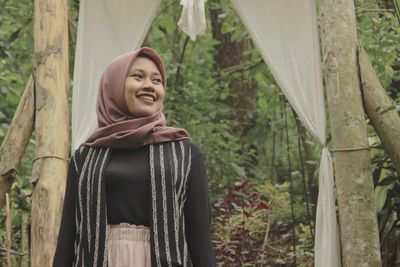 Muslim women enjoy the morning air in the pine forest