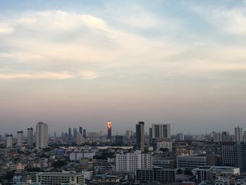 Cityscape against sky during sunset