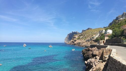 Scenic view of sea against blue sky