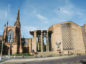 Buildings in city against sky