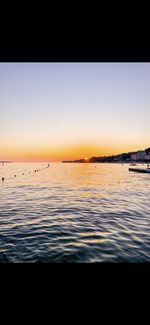 Scenic view of sea against sky at sunset