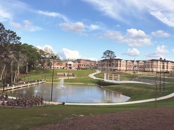 Fountain in park against buildings