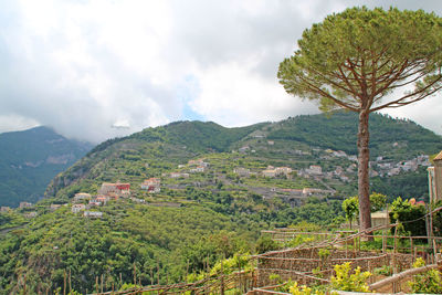 Scenic view of mountains against cloudy sky