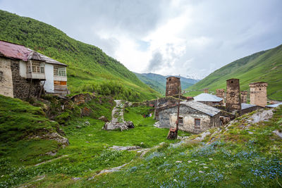 Panoramic view of buildings and mountains against sky