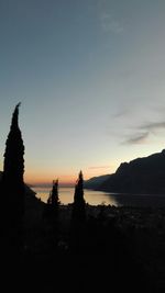 Scenic view of river at sunset