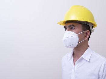 Portrait of man working over white background