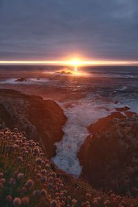 Scenic view of sea against sky during sunset