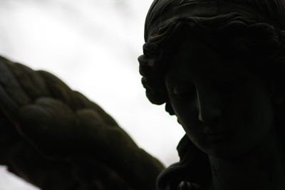 Low angle view of statue against sky