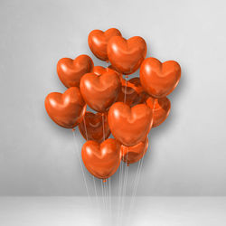 High angle view of red heart shape on white background