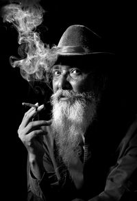 Portrait of man smoking cigarette