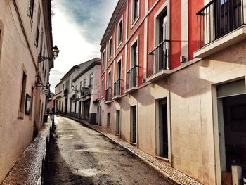 Alley amidst buildings in city