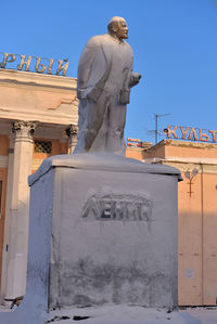 Statue against clear blue sky