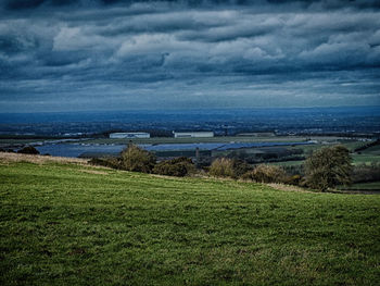 Scenic view of landscape against cloudy sky