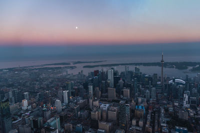 High angle view of buildings against sky at sunset