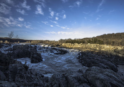 Scenic view of landscape against blue sky